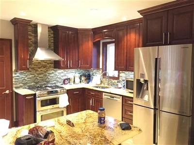 Kitchen in Hollis 
TSG Pacifica cabinet with solarius granite